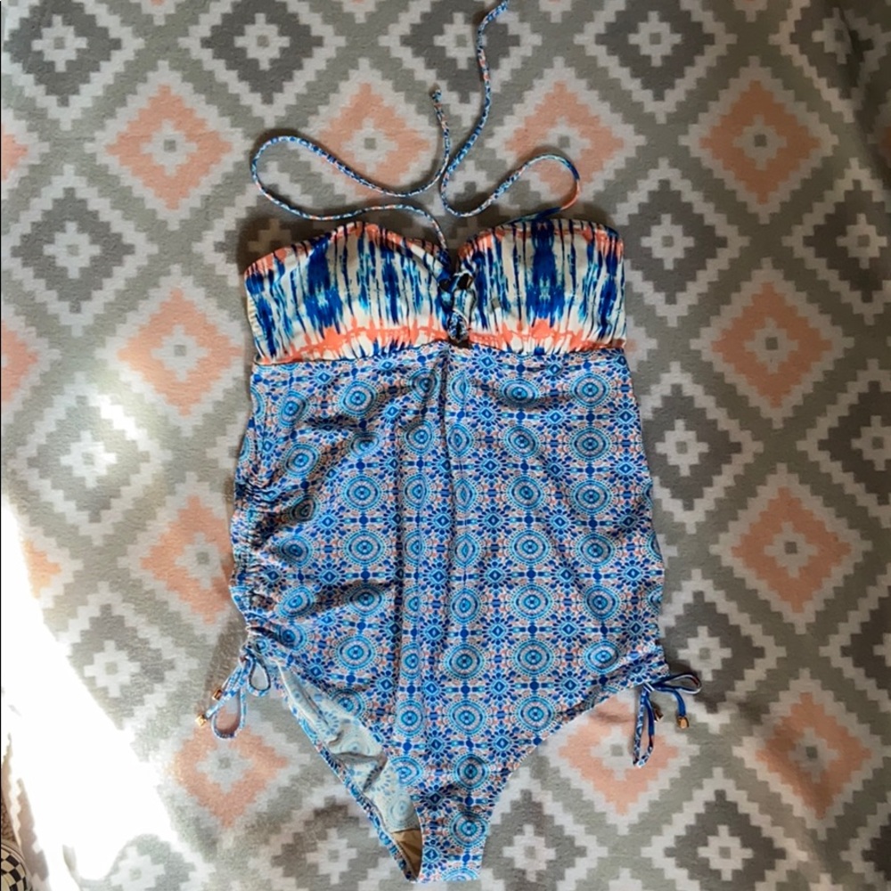 A Pea in the pod one piece swimsuit. Size Medium.